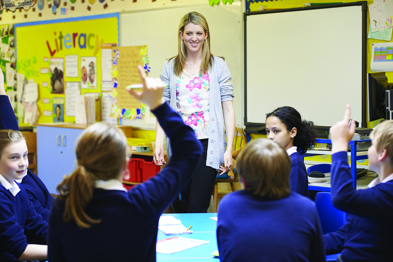 Teacher helping learners